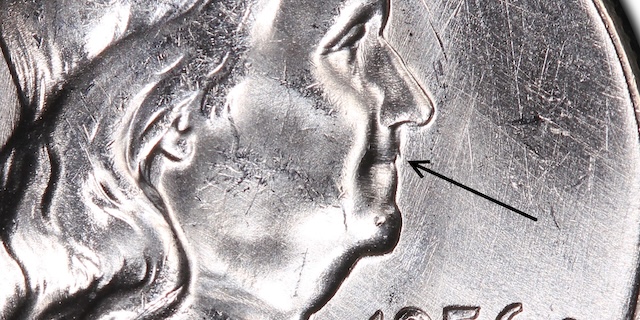 1956 Franklin Half Dollar Bugs Bunny FS-401 variety showing die clash lines above eagle beak on reverse